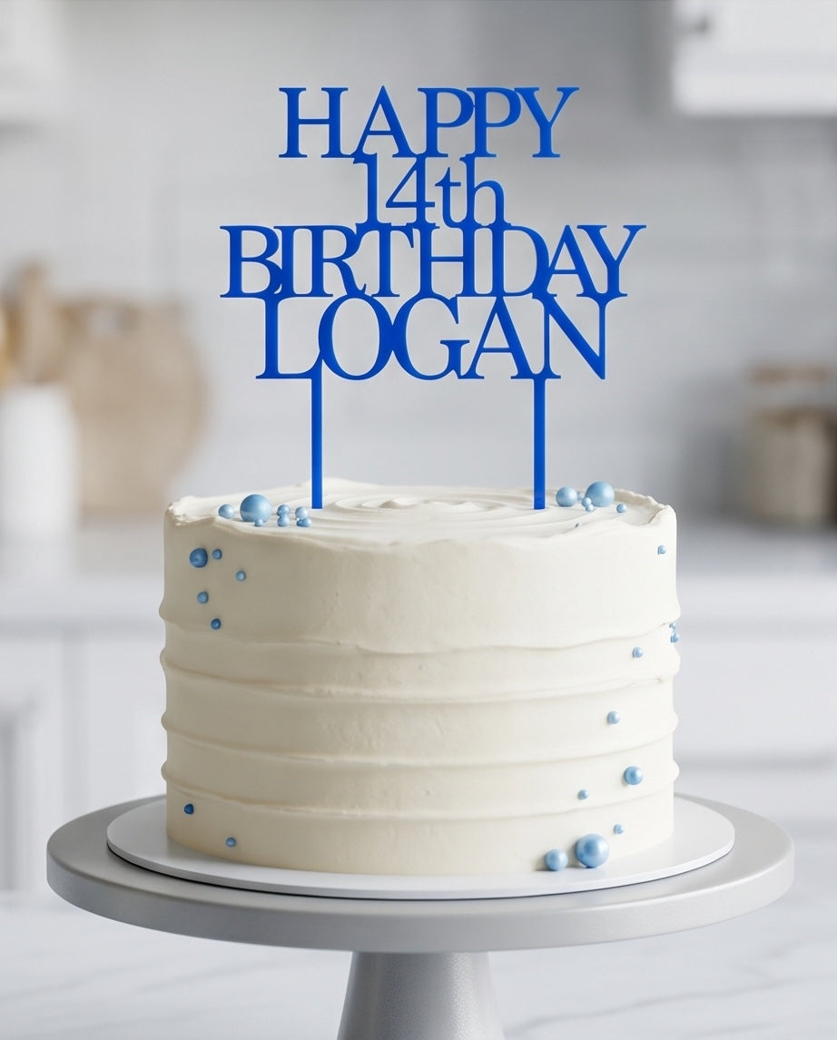 Personalised blue acrylic birthday cake topper displayed on a white cake